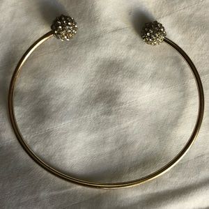 Gold cuff bangle w. pave balls